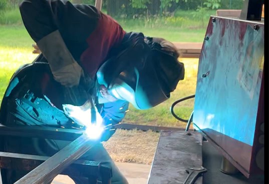 Welders at work, metalworking, industrial work, professional welding in metal fabrication.